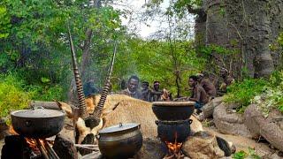 Hadza Tribe's Hunters Shelter Under Large Rock After Catching Big Animal