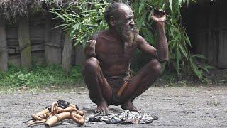Dani tribe man selling kotekas