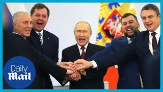 Putin holds hands with Russia-backed leaders chanting 'Russia, Russia, Russia!'