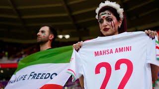 Iran players sing national anthem | pro-government supporters confront protesters at World Cup