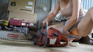 Girl repairs and restores old Old Gasoline Chainsaw STIHL abandoned long ago.