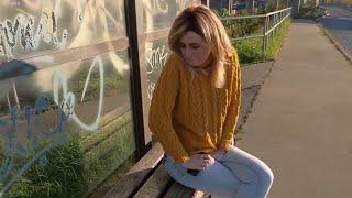 Girl has a Pee desperation on Bus Stop