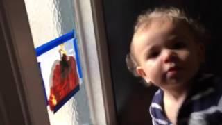 Dyl paints a pumpkin on the window 10/21/14