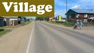 Riding the bike in a small russian village in the region Krasnoyarsk. Everyday life in Siberia