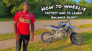 HOW TO WHEELIE A DIRT BIKE TUTORIAL! FASTEST WAY TO LEARN BALANCE POINT (YZ450F) KO9ETV