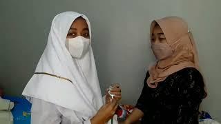 A Muslim Female Nurse Listens To The Heartbeat of a Hijab Patient