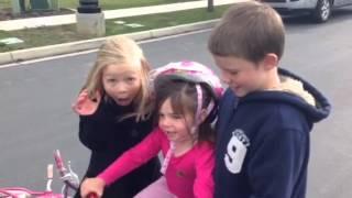 Caleb teaches Chloe to ride her bike