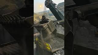 Bucket loading of open pit coal ore- Good tools and machinery make work easy