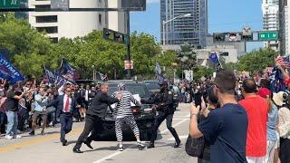 Protester rushes Trump motorcade after leaving federal court in Miami!