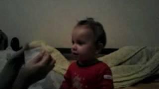 baby laughing at blowing nose