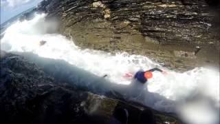 Coasteering in huge swell near Penzance, Cornwall - Kernow Coasteering