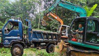 the driver and the girl Driving an excavator,Car carrying sand Stream stormy day,Flooding.