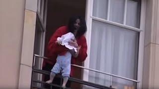 Michael Jackson dangles his baby over a hotel balcony