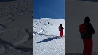 Henry enjoying safe powder turns on a bluebird day