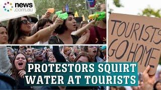 Spanish Locals Spray Water At Barcelona Tourists In Bold Protest