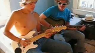 Two guys playing with toy guitars - Venice Beach