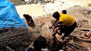 Daily life of nomads: helping and separating stones to build huts.