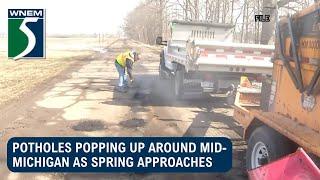 Potholes popping up around mid-Michigan as spring approaches