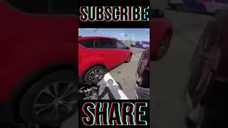 Car Backs Over Motorcycle Caught on Camera