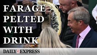 Moment Nigel Farage is pelted with 'milkshake' by mystery woman