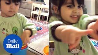 Adorable girl gets super-excited as she solves a puzzle