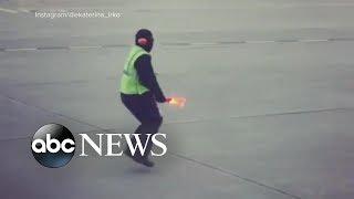 Airline worker's dance moves bring smiles and goes viral