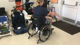 Power assist wheels for manual wheelchairs