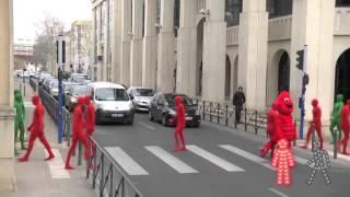 Red and Green morph men crossing road