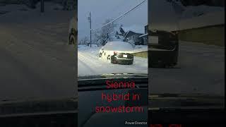 sienna Hybrid AWD in snowstorm.