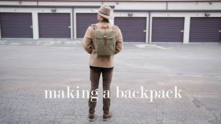 making a backpack out of waxed canvas and leather while birds chirp in the background