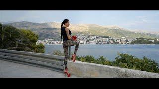 Lara Croft style walking in red high heels