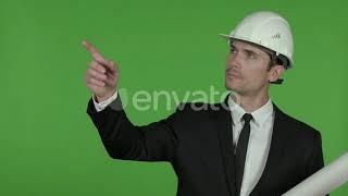 Engineer Holding Blueprint and Pointing with Finger Chroma Key Video Footage Stock