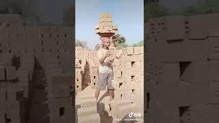 Hard labor bricks carrier in India!