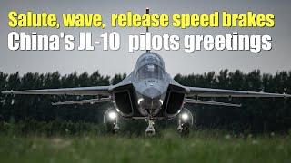 China's JL-10  pilots greetings:Salute, wave,  release speed brakes