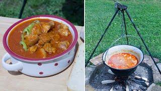 Ultimate Pork Knuckle Stew in Cauldron on Crackling Fire