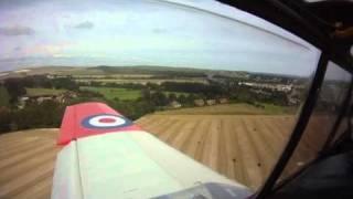 De Havilland DHC.1 Chipmunk G-BZGA landing on grass at Shoreham.