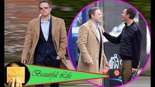 Ben Affleck keeps warm in camel coat as he bumps into producer Scott Stuber on school run in LA