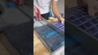 Tile setter using Montolit Rubber Mat to cut fragile glass mosaic fast