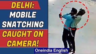 Delhi: CCTV footage shows brutal mobile theft, men flee from scene | Oneindia News