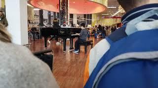 Playing Santa Claus is Coming to Town in a piano in the Orio Al Serio Airport!