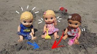 Baby Alive doll sisters buried in the beach sand!