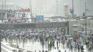 Rain showers in Mina as pilgrims resume symbolic stoning of the devil in Hajj heat