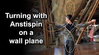 Advanced Poi Spinning: Turning with Antispin on a Wall Plane