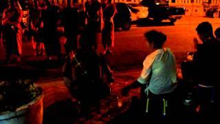 Buddhist monks chanting thanks after receiving alms in Vientiane, Laos