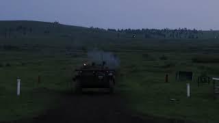 An infantry fighting vehicle (bmp-2) firing at night