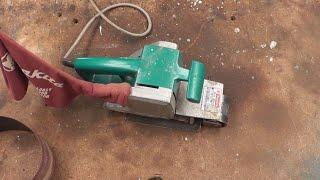 Makita belt sander brush change