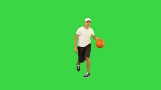 Young Basketball Player Training Before Game Throwing Ball in Basket on a Green Screen Chroma Key