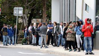 Government urges people to go home as massive lines form at Centrelink centres