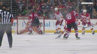 Erik Haula scores a goal against the Calgary Flames