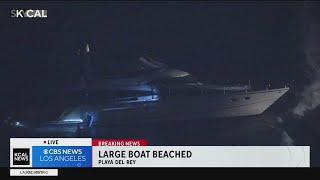 Large boat drawing water after beaching in Playa Del Rey